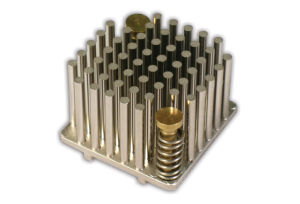 Round Pins, holes and standoffs formed in the tool in a single operation